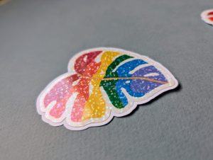 Easy-peel die cut vinyl sticker featuring LGBTQ+ pride design that was originally painted using gouache.