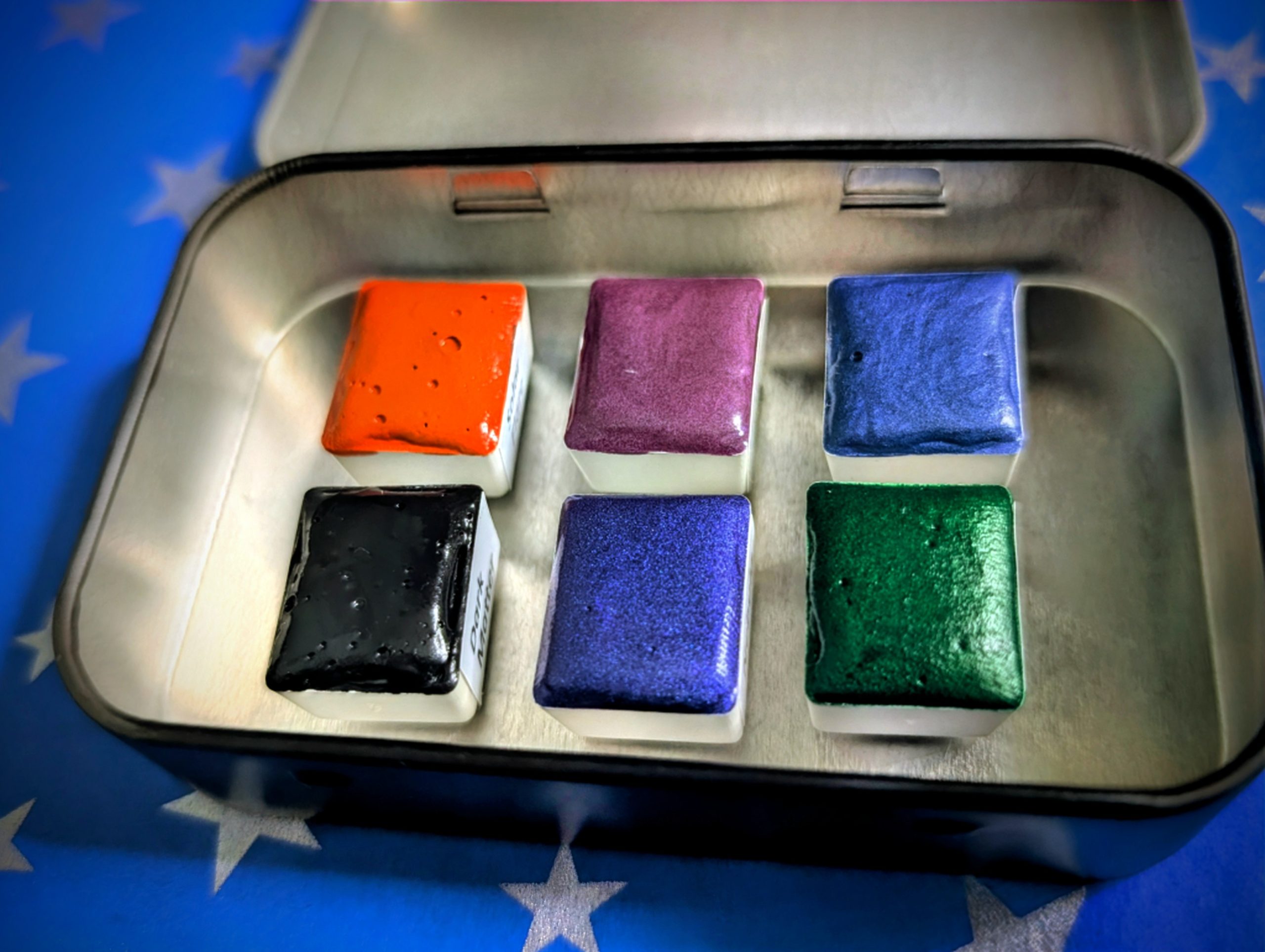 Watercolour Tin showing 6 half pans of handmade watercolours